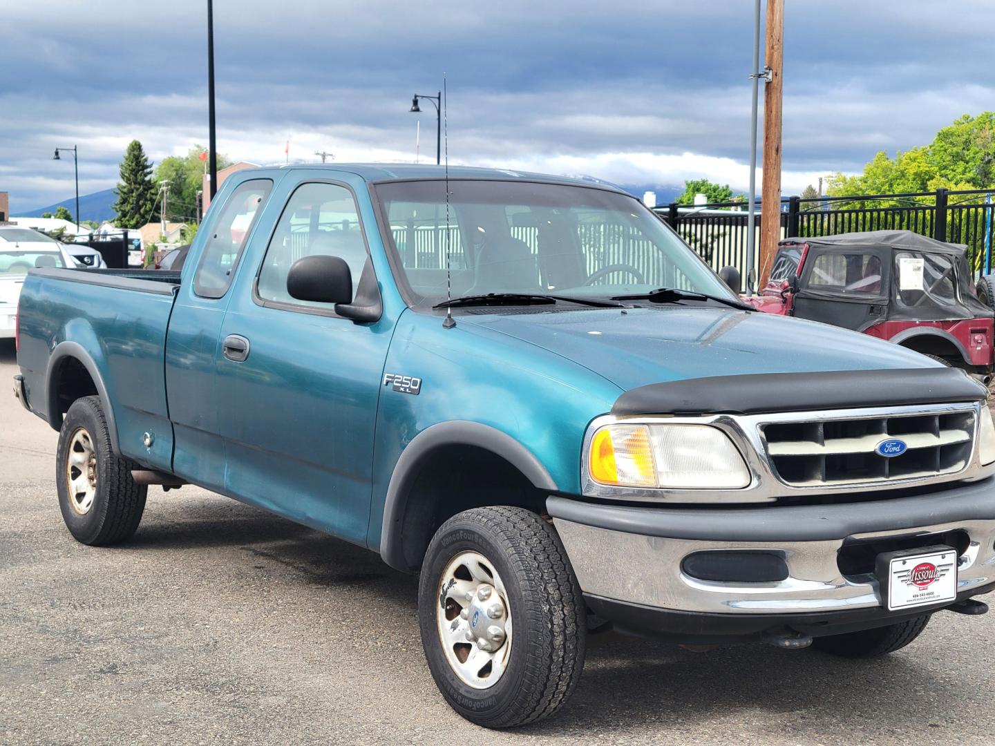 1997 Green /Tan Ford F-250 (1FTFX2866VK) with an 4.6L V8 engine, 4 Speed Manual with Overdrive transmission, located at 450 N Russell, Missoula, MT, 59801, (406) 543-6600, 46.874496, -114.017433 - 4.6L V8 Engine. 4 Speed with Overdrive Manual Transmission. 4 Wheel Drive. 3 Door. Short Box. Air Conditioning. Cruise Control. Financing is NOT Available. - Photo#3